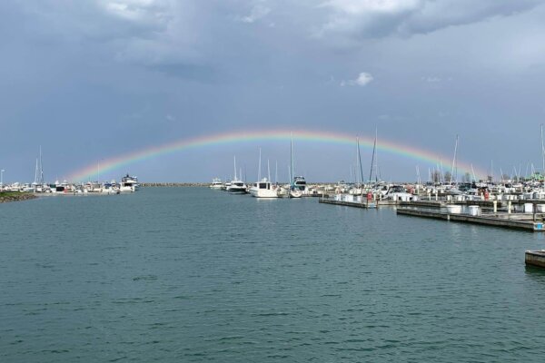 Rainbow casting over wet boat slips at North Point Marina